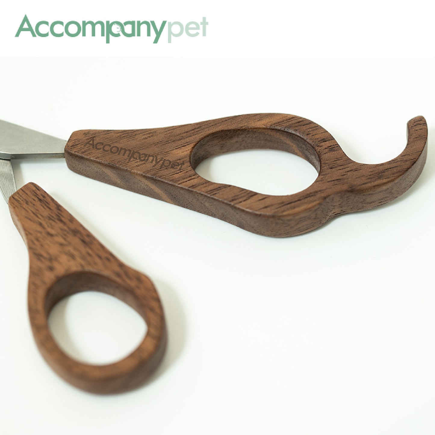Hand-polished ergonomic black walnut handle providing superior control for stress-free pet grooming